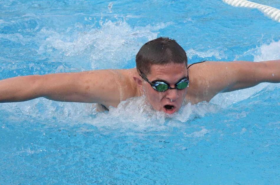Ryan Palmer (11) competes in one of his events. Varsity swimmers competed against Kings Academy today at a home meet. 