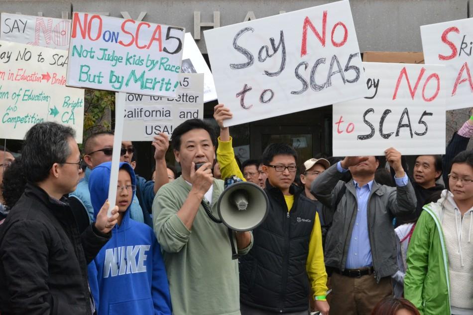 Several volunteers conducted a protest of the SCA-5 amendment outside the Cupertino library.