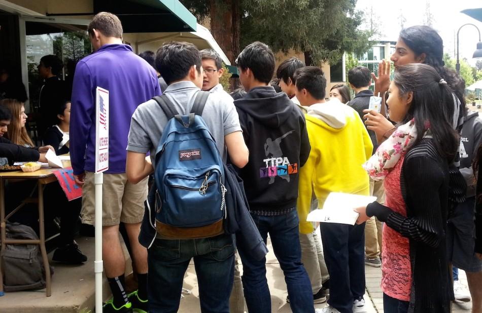 Students line up in front of the journalism room for codes to access computers to vote. Candidates for the junior class especially differed this year due to class officers who were elected to join the ASB Council.
