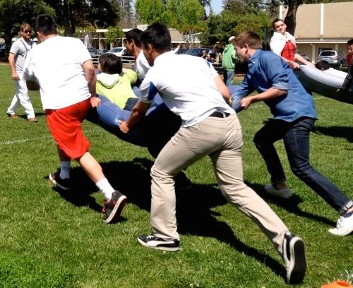 Members of the sophomore class participate in the mattress racing held at lunch. - See more at: https://harkeraquila.com/17735/news/students-and-teachers-alike-get-spirited-for-fictional-character-day/#sthash.eZJJ1mAw.dpuf