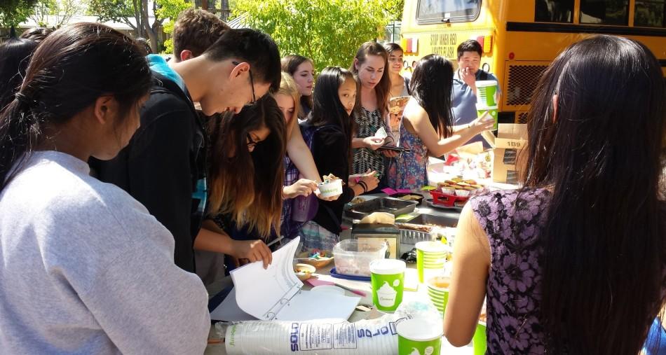 Students swarm around the Key Club table after school
to buy food. Baked goods sold for various amounts of money and frozen
yogurt was sold for $5.