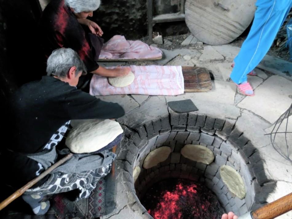 Natives in the Armenian village of Harav make traditional Armenian bread early in the morning.
