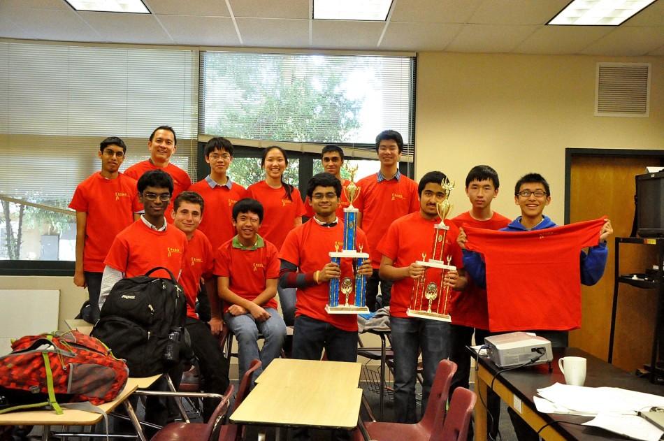 Participants in the Bay Area Math Olympiad (BAMO) pose in their BAMO T-shirts and hold up their trophies. Patrick Lin (11), Ashwath Thirumalai (11), and Vikram Sundar (12), who each had perfect scores and were Grand Prize winners, helped the Upper School win first place. 