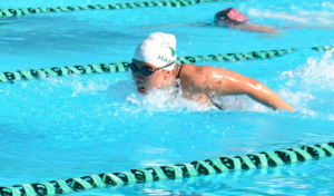 Caption for Swimming Pic: Kimberly Ma (12) swims the butterfly. Kimberly qualified for the CCS meet which will be held on May 29.