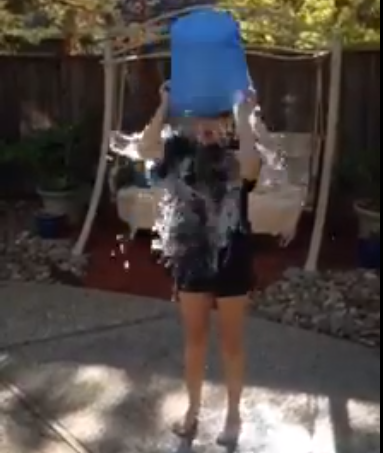 Riya Godbole (12) pours a bucket of ice water on herself in honor of the ALS Ice Bucket Challenge.