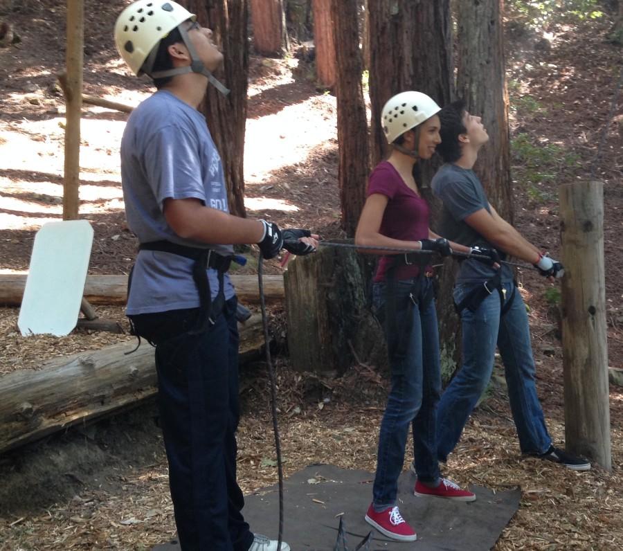 Aditya Dhar (10) and Sanjana Marce (10) pull the belay in order to help a member of their advisory climb a tree. Teamwork was a key component of making each activity a success.
