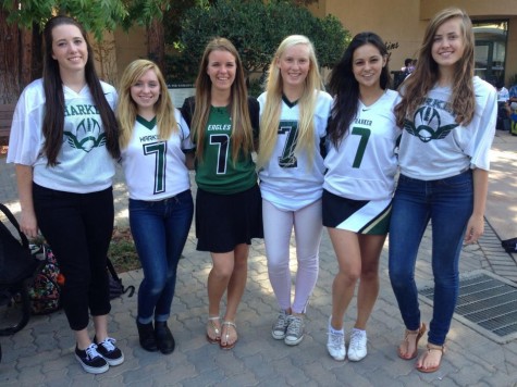 (From left to right) Seniors Sheridan Tobin, Zoe Woehrmann, Alyssa Amick, Delaney Martin, Erika Olsen, and Madi Lang-Ree show their support for fellow kicker Alyssa in matching #7 football jerseys. A football jersey employed to ingeniously conceal the misguided artwork that is your class T-shirt is the consummate blend between displaying Eagle spirit and saving yourself from perpetual humiliation.