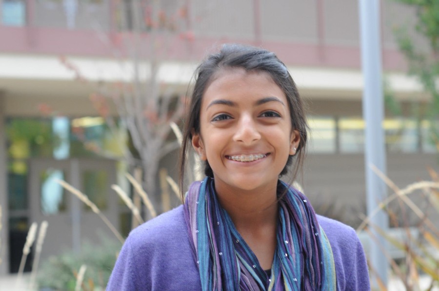 Namitha Vellian (11) accessorizes a solid-colored sweater with a multi-hued scarf, achieving an effortlessly fashionable look. In addition to being used as stylish accessories, scarves can also serve to shield you from the disbelieving stares directed at your class T-shirt by faculty and other students. 