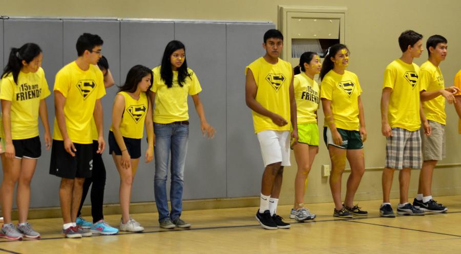 The senior class discusses its strategy for the dodgeball game. The seniors made an interesting entrance, running into the gymnasium and rooting for their class.
