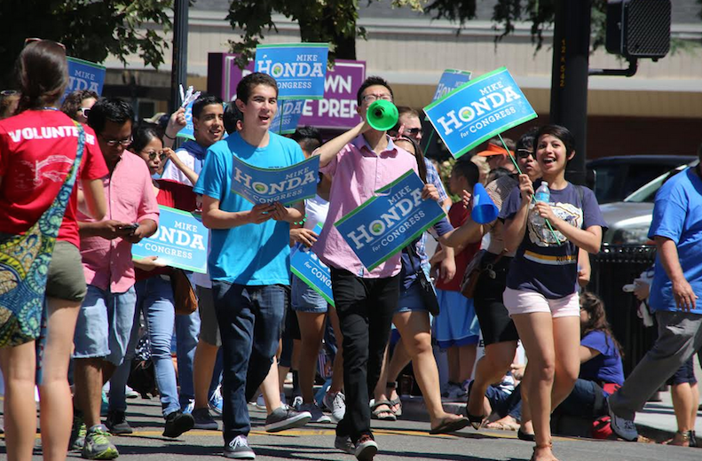 Felix Wu (12) marches as part of Congressman Mike Hondas team at the 4th of July Rose, White and Blue Parade in San Jose. Felix currently serves as field director on Anthony Phans run for East Side Union High School District Board. 