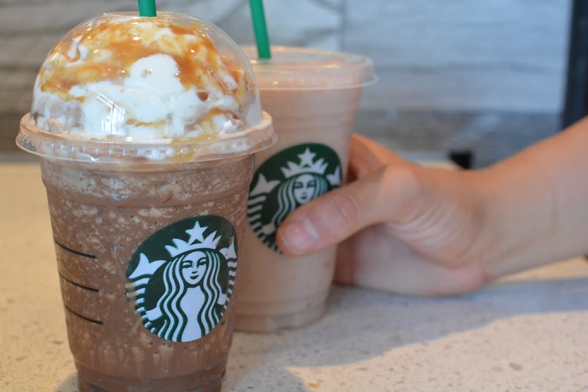 Shown are a Salted Caramel Mocha Frappuchino and Strawbana smoothie. Students and faculty can purchase these drinks by walking or driving to the new Starbucks across the street.​