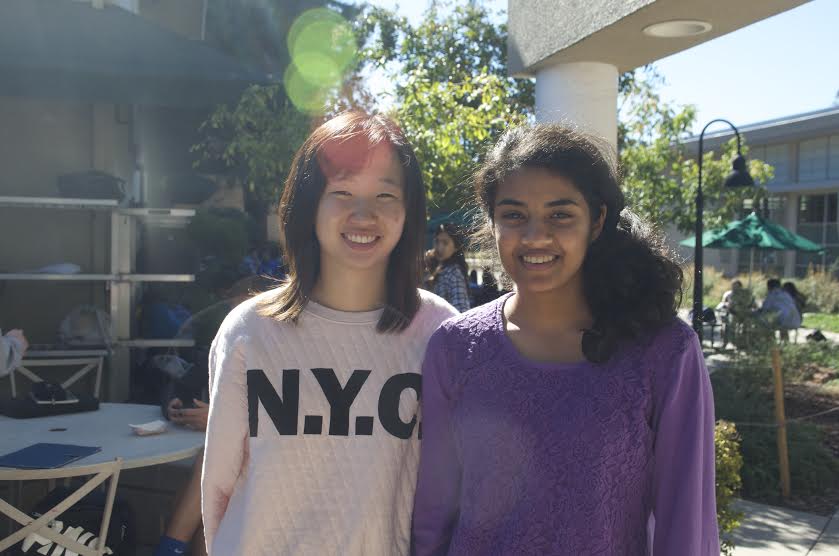 Madelyn Wang (12) and Archana Podury (12) wear sweaters during the fall. 
