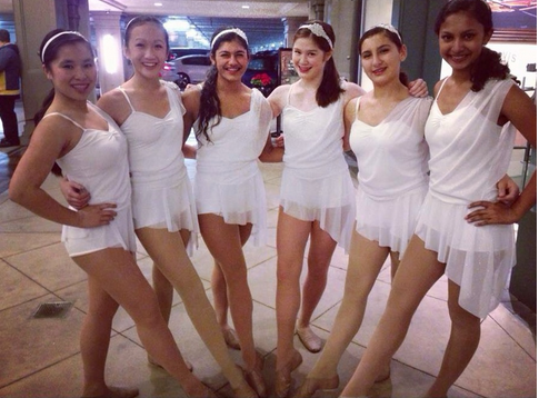Freshman members of 2013-2014’s JV Dance Troupe, LeAnn Nguyen, Lindsey Trinh (10), Noor Singh (10), Tamlyn Doll (10), Hazal Gurcan (10), and Surabhi Rao (10) pose before performing at the Santana Row Tree Lighting ceremony. They danced to the Christmas classic song It’s a Wonderful World. 