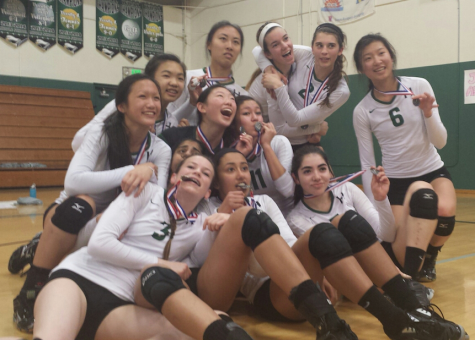 The Varsity girls' volleyball team poses with medals earned after their second place finish in the CCS finals. The girls received the no. 3 seed in the Norcal tournament.