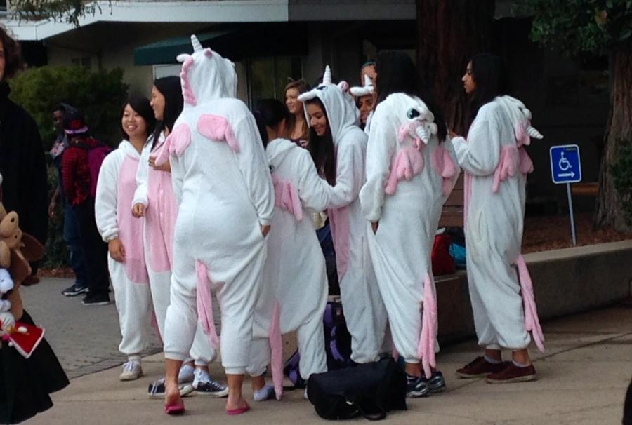 The Varsity Girls Tennis team wears unicorn costumes. Students dressed up in various costumes to celebrate Halloween.