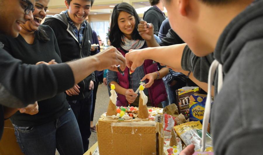 Nikhil Reddy (12) and Jason Chu (12) drizzle food coloring onto the seniors gingerbread sculpture. The contest ended with freshmen in first place, sophomores in second place, juniors in third place and seniors in fourth place.