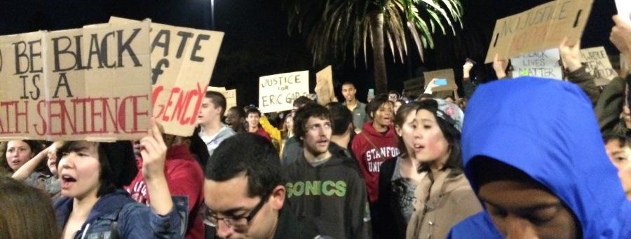 Students at Stanford University hold signs to protest the grand jury decision not to indict the law enforcement official involved in the chokehold death of Eric Garner.
