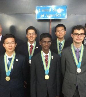 Vikram Sundar (14) poses alongside teammates at the International Physics Olympiad in Astana, Kazakhstan. The team of four went on to win the gold medal.