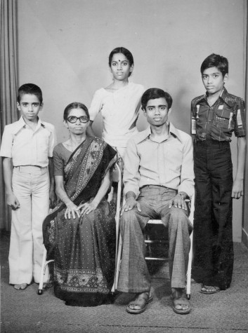 My dad (seated, right) poses with his three younger siblings in this formal photo.
