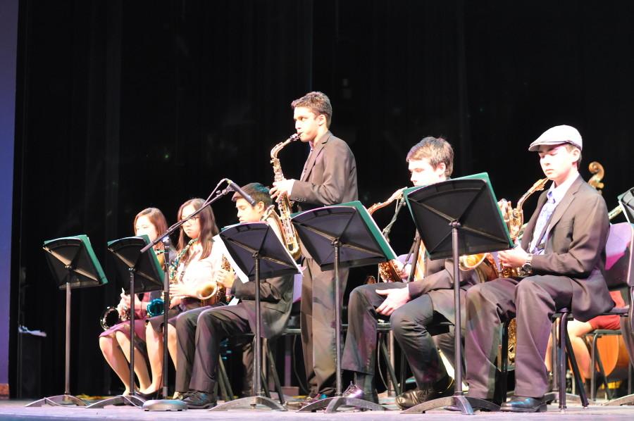Rishabh Jain  plays a saxophone solo in the Upper School Jazz band’s piece “Spain.”
