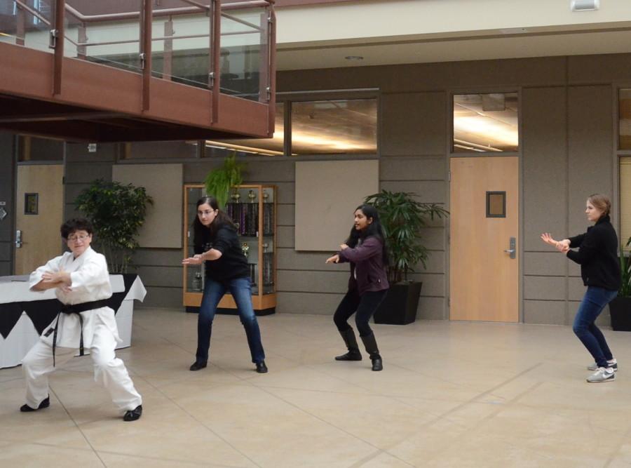Students who attended the workshop practice a skill taught to them. The workshop was held in the Nichols Atrium during long lunch.
