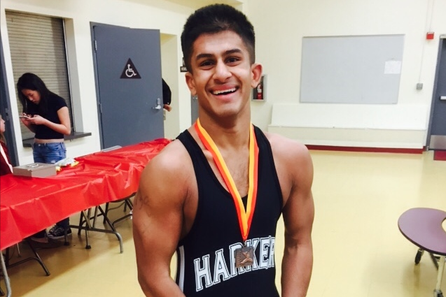 Anni Ankola (12) poses at his most recent tournament that took place over winter break. He started wrestling junior year and is now current team co-captain. 