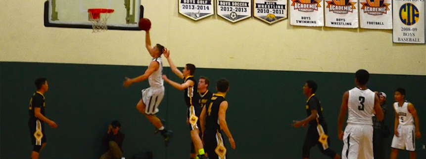 Eric Holt (12) goes for a layup. The eagles won 71-38 against Del Mar High School.