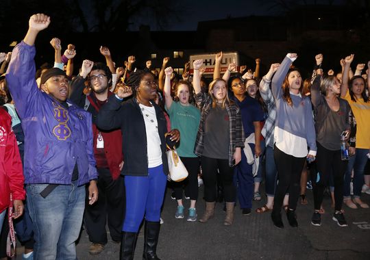 University of Oklahoma students rally outside the closed Sigma Alpha Epsilon fraternity house during a rally in Norman, Okla. The two fraternity members accused of leading the singing of a racist chant were expelled from the university.