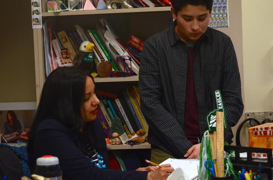 Michael Sikand (9) talks with his math teacher Jeanette Fernandez. Fernandez looks forwad to meeting him and his parents during the second round of parent-teacher conferences.