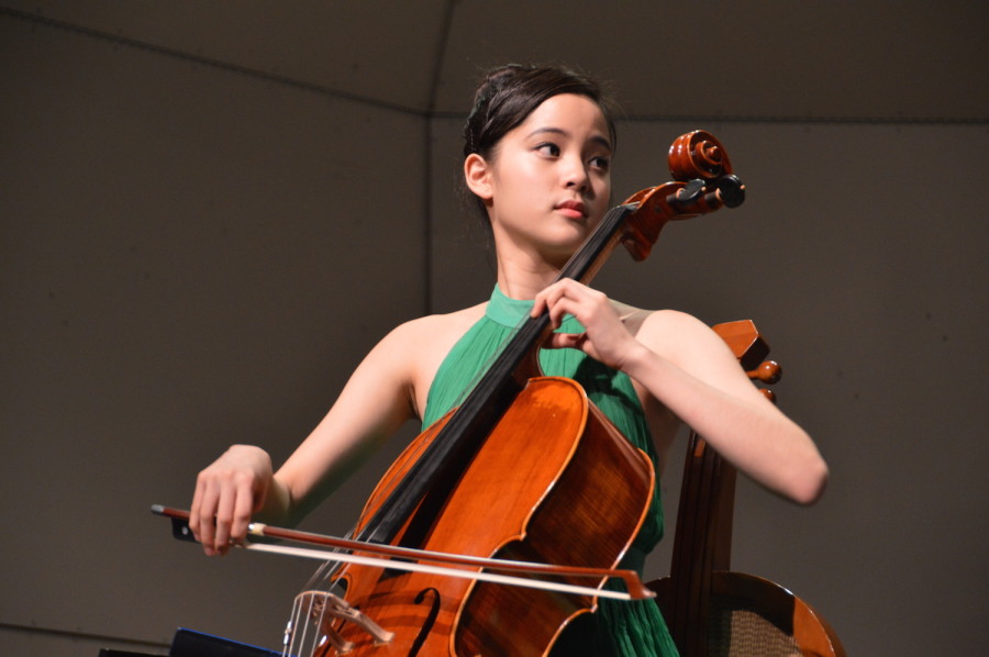 Nana looks toward her partner, as she plays the cello. She performed at a United States International Music Competition Benefit Concert on March 21.  