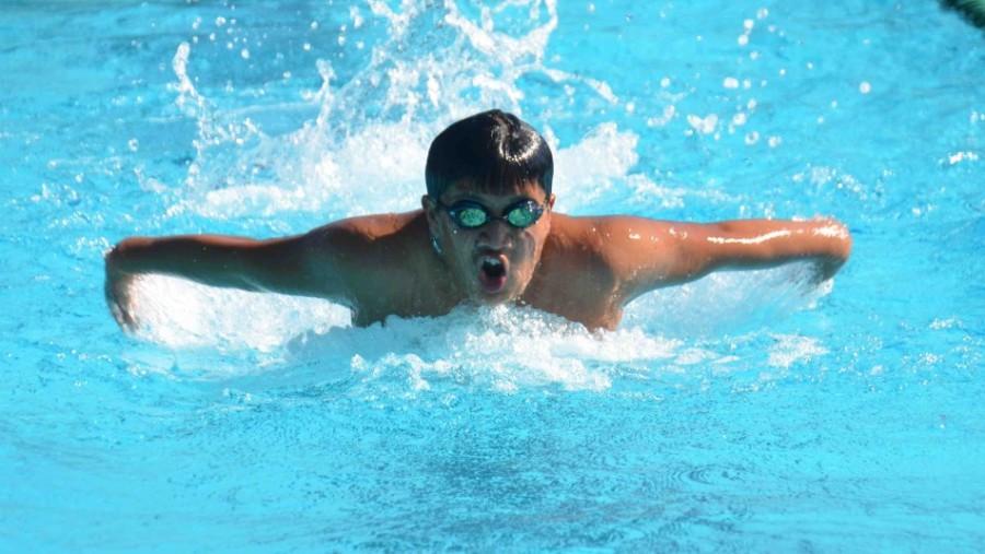 Senior+Leon+Chin+swims+butterfly+across+the+pool.+Swim+team+seniors+will+be+honored+at+their+senior+night+against+Kings+Academy+today.