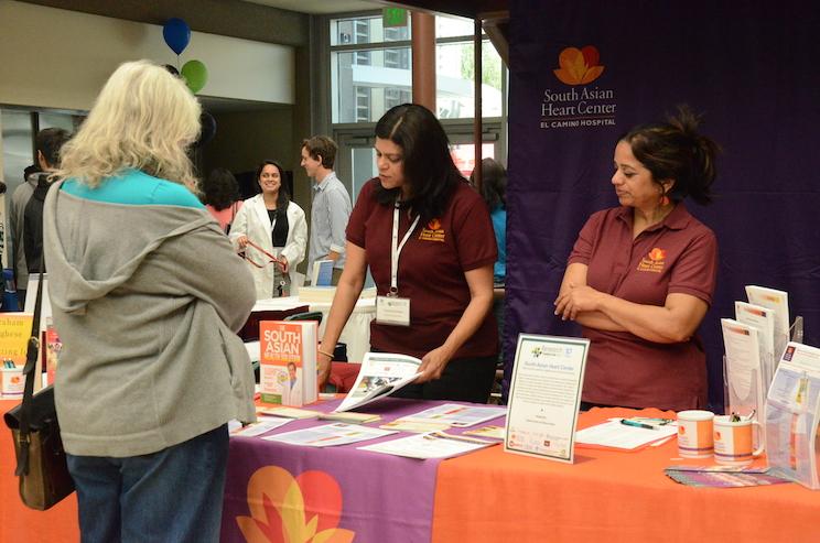 Volunteers from the South Asian Heart Center promote their services to symposium attendees. The Harker Research Symposium celebrated its 10th anniversary on Saturday.