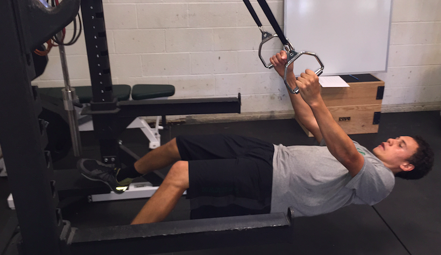Christian Williams (12) trains in the gym off-season for football on Monday afternoon. As summer approaches, more students amp up health and fitness goals.