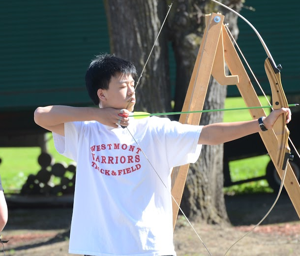 Dylan Hwang (10) prepares to shoot an arrow. Dylan is the 9th ranked junior archer in the United States.