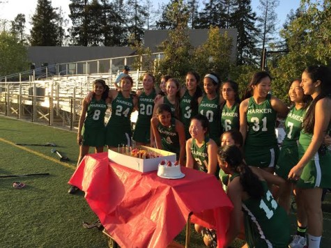 The lacrosse team celebrates captain Allison Kiang's 18th birthday after the game.