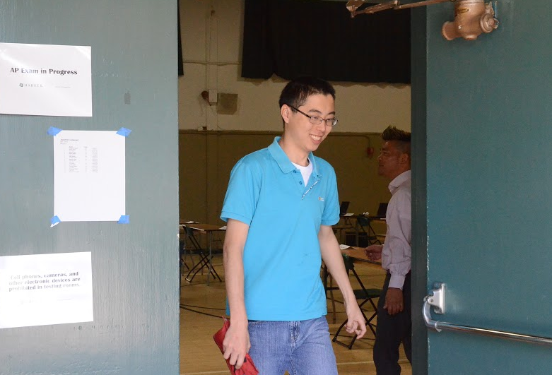 Stanley Zhao (11) walks with his pencil case out of an AP exam. AP exams end on May 15th.