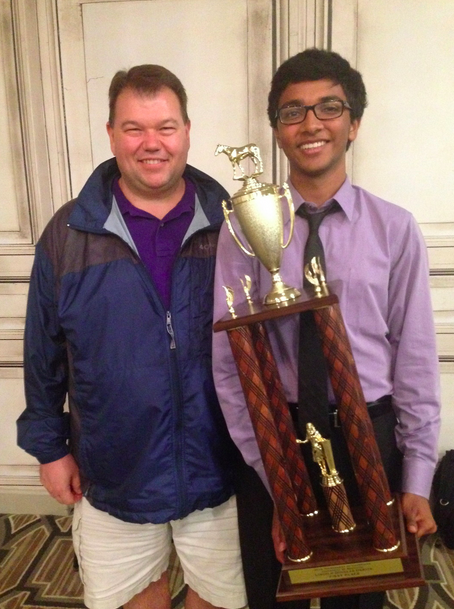 Senior Pranav Reddy poses with his trophy after being crowned the national champion of Lincoln Douglas debate. This is his second consecutive year of winning this prestigious competition.
