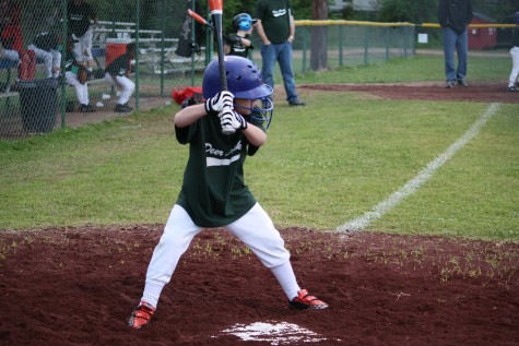 A little league athlete comes up to bat.