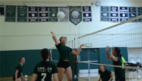 Doreene Kang (12) hits the volleyball during the girls' volleyball summer practices.