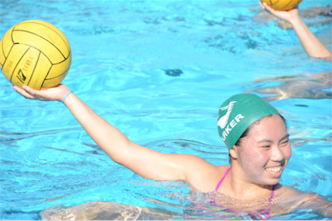 Karen Tu (12) throws a water polo ball during a girls' water polo summer practice.
