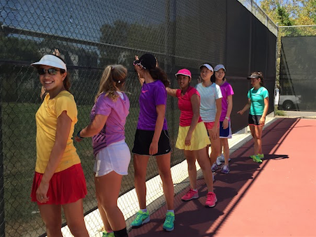 The girls' tennis team warms up during a summer practice.