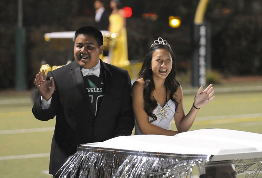 Davis+Howard+%2811%29+and+Lindsey+Trinh+%2811%29++wave+to+the+crowd+during+the+2014+Homecoming+game.+Davis+and+Lindsey+were+the+class+of+2017s+prince+and+princess+in+2014.