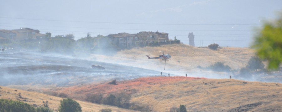 A large fire burned the side of a hill in Evergreen, San Jose, in a community called the Ranch at 4 pm today. Starting off as a small fire, it grew and climbed up the hills, partly due to the wind; several emergency fire trucks and helicopters were present at the site of the fire, pouring water onto the hill and checking for any injured victims.