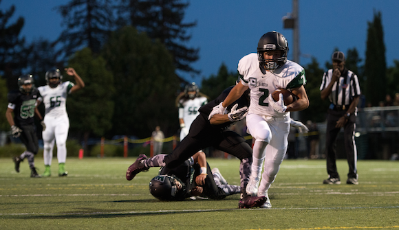 Johnathan Keller (12) avoids being tackled by Yerba Buena defense. The Eagles lost 21-38.