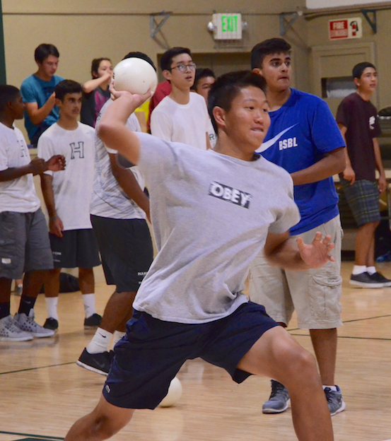 Facing off the junior class, sophomore Brandon Mo gets ready to fling the ball during the dodgeball tournament. Spirit Kickoff had an increase of 100 people compared to last year’s turnout.
