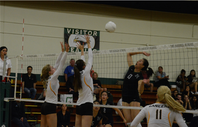 Doreene Kang (12) prepares to spike the ball. The Eagles lost to first-ranked St. Francis in their home opener today.