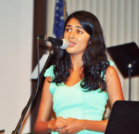 Aashika Balaji (12) sings during the performance. where classical western and Indian instruments played together.