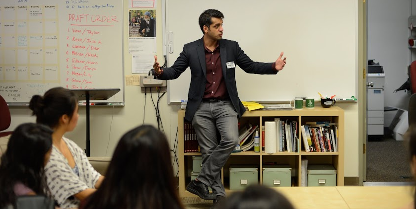 Wajahat Ali speaks to a group of students and faculty in the journalism room. Ali spoke at the Upper School on Friday.
