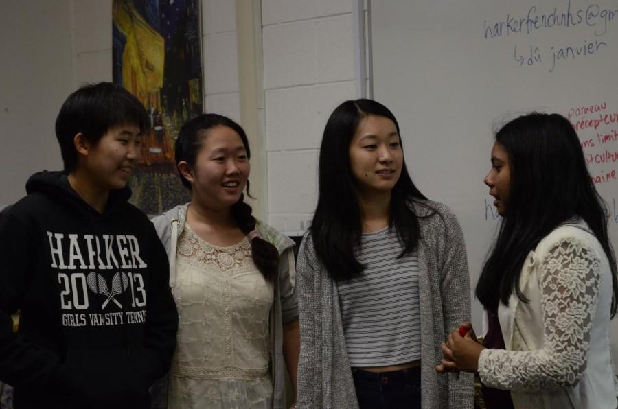 Connie Miao (11), Daphne Yang (12), Victoria Ding (12) and Samali Sahoo (12) discuss the protocol for the year. The society will organize Club Week, plan cultural night and publish “Sans Limite” in the spring.