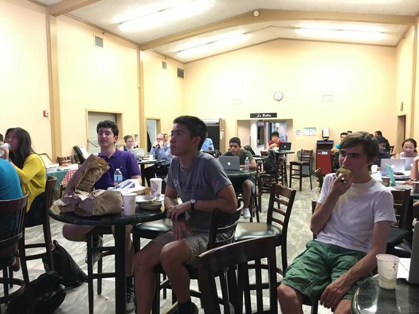Students watch the democratic debate during Pizza and Politics night.  The event was organized by Junior State of America (JSA), Econ Society, and the Issues Discussion Club (IDC).